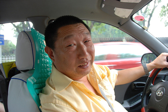 Finally this taxi driver stopped for us.  He loved my camera and kept grabbing it.