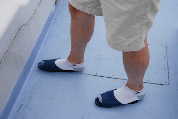 We removed our own shoes for the dinner cruise, but had to put on their slippers when we went up top.  None were big enough for Jim, Trent or Jason!