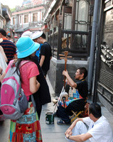 A blind guy was playing an instrument for money.  We see disabled guys on the street often.