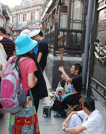 A blind guy was playing an instrument for money.  We see disabled guys on the street often.