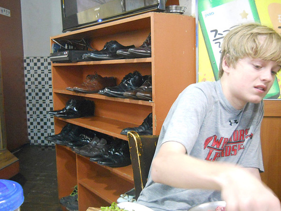 We chose a Korean barbecue and Jason sat next to the shoes storage!
