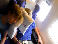 Boys sleeping on the four-hour flight to Tokyo.