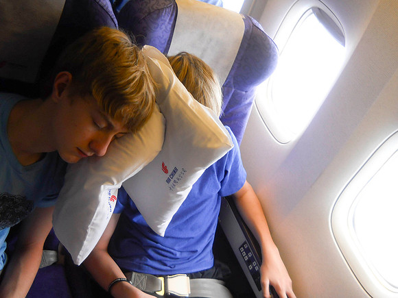 Boys sleeping on the four-hour flight to Tokyo.