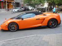 Orange Lamborghini outside the famous dumpling place.