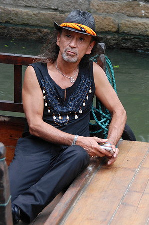 An interesting guy going by on a boat.