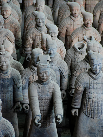 The guy with his arms out was a chariot driver.