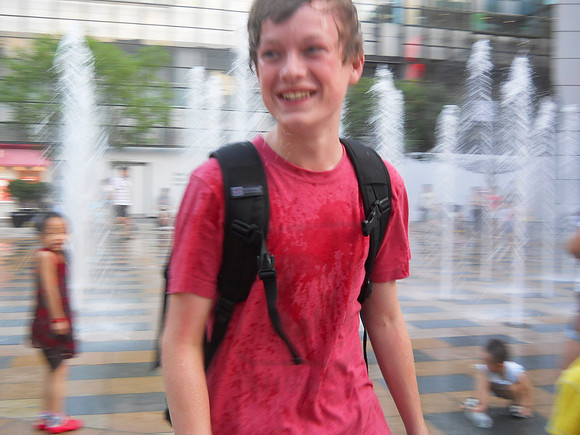 Jason ducked his head into the water fountains at Sanlitun.