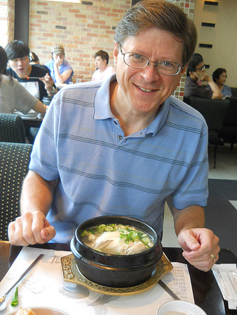 Jim having the famous Ginseng chicken soup.  It had an entire small chicken in it; no head, though.