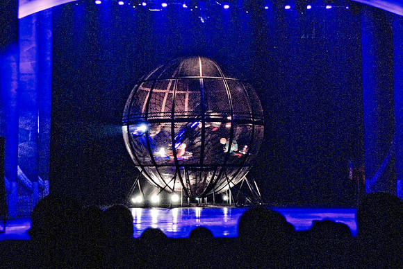 Motorcycle guys inside a sphere.