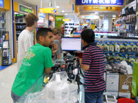Jesse (neighbor) helps us negotiate a price at the electronic store.  He is from San Francisco.