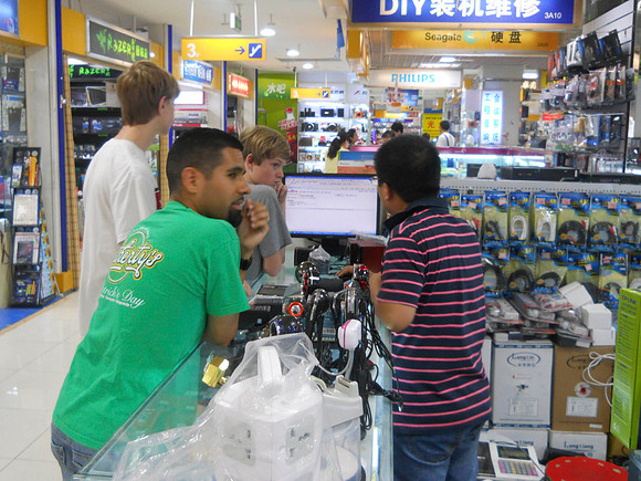 Jesse (neighbor) helps us negotiate a price at the electronic store.  He is from San Francisco.