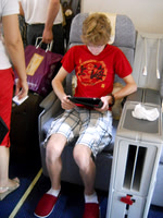Wearing the slippers in business class.