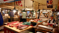 Cutting the large tuna.  Later our bus guide said this is the largest fish market in the world.  We believe it.  It was vey busy and everyone had their own work to keep them busy.