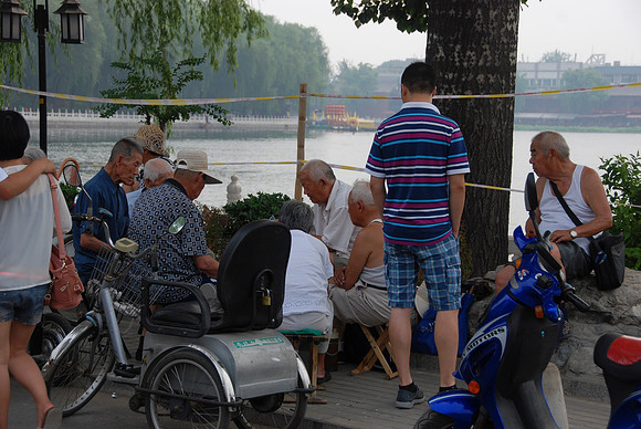 We often see older men sitting around playing a lively game of cards or chess.